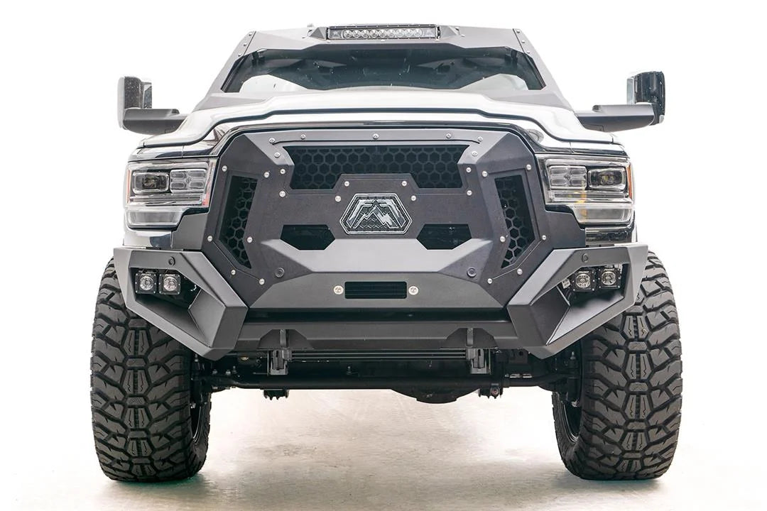 Fab Fours ViCowl on a white Ram 2500, straight-on front view, showing the windshield frame cover, LED light bar, and cowl shape