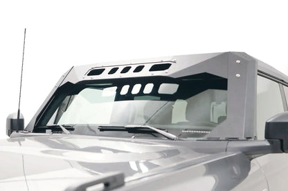 Fab Fours ViCowl on a gray Ford Bronco, driver-side view, showing the matte black steel cowl and slotted roof visor framing the windshield