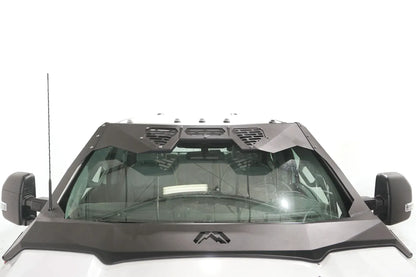 Fab Fours ViCowl Windshield Protection on a Ford Super Duty, front view, showing the full steel frame around the windshield with three vented top panels and Fab Fours logo on the cowl