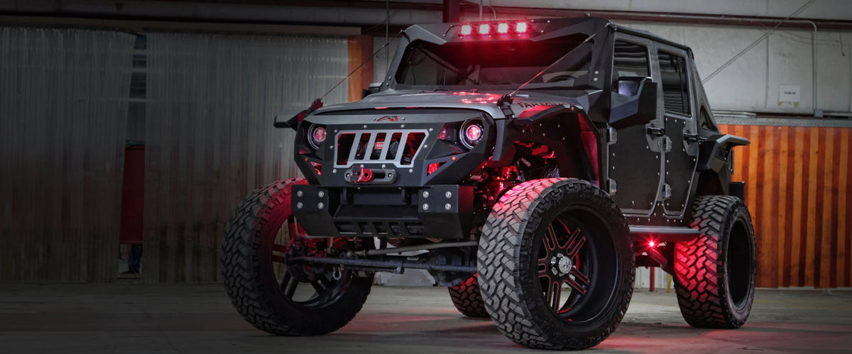 Fab Fours Mall Assault 2015 Jeep Wrangler JK with red LED underglow in warehouse